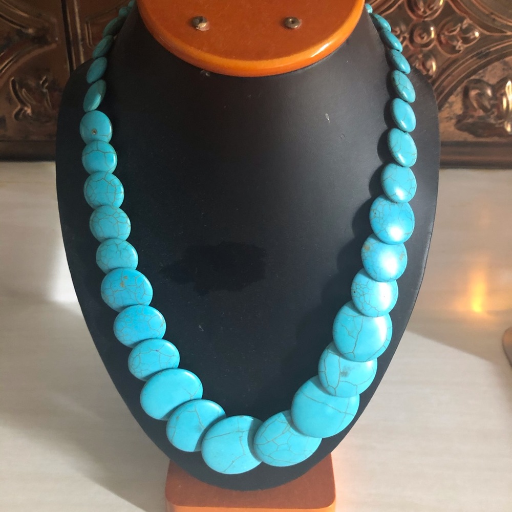 Turquoise stone necklace.